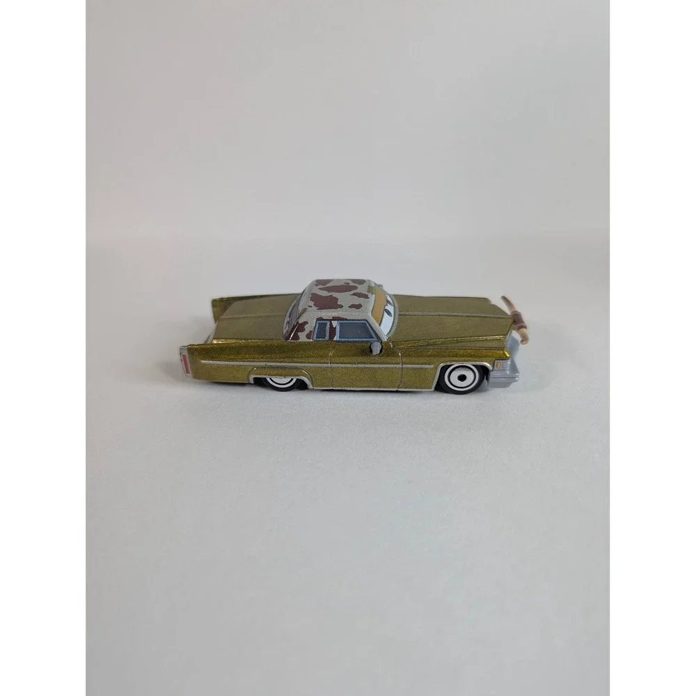 Disney Pixar Cars Tex Dinoco Gold Cadillac Diecast Toy Car Longhorns Mattel
